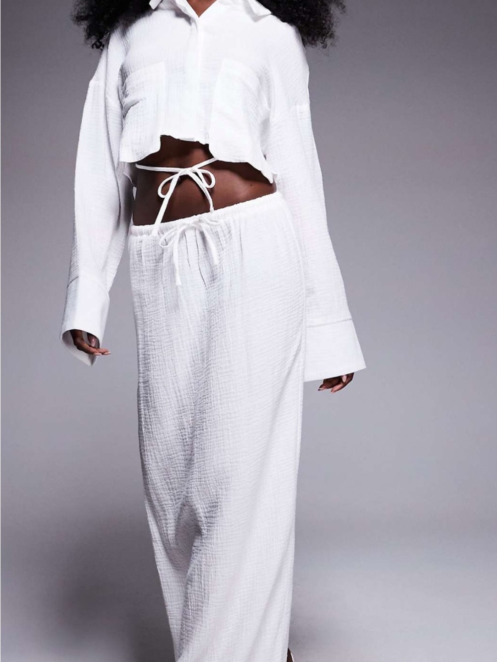 White maxi skirt with an elastic drawstring waist.